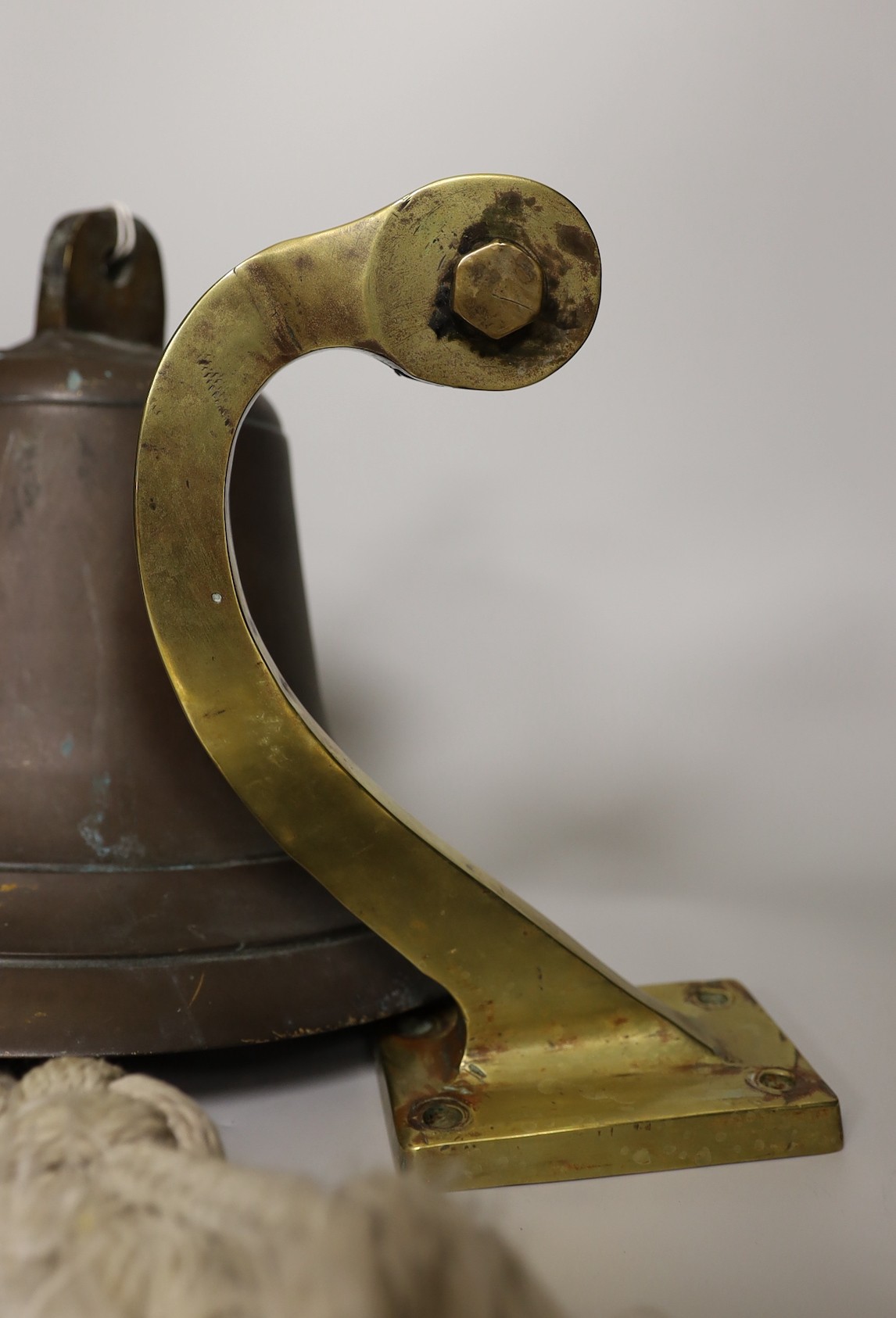 A ship's bell with brass bracket, salvaged from Chittagong ship yard between 1984-1989